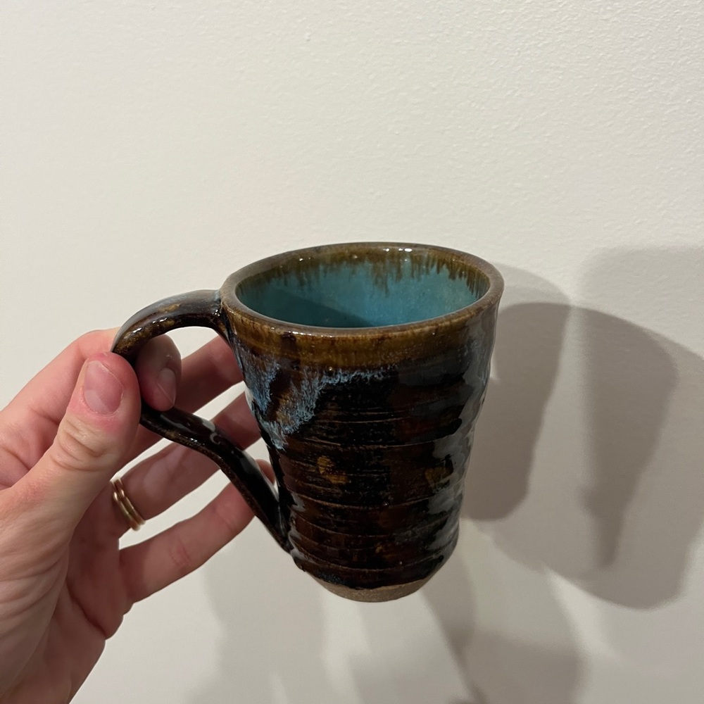 Handcrafted Brown Ceramic Mug with Blue Interior and Ribbed Outer Pattern